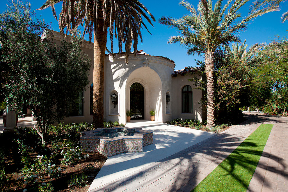 Example of a large transitional natural backyard brick and rectangular exterior home design in Phoenix