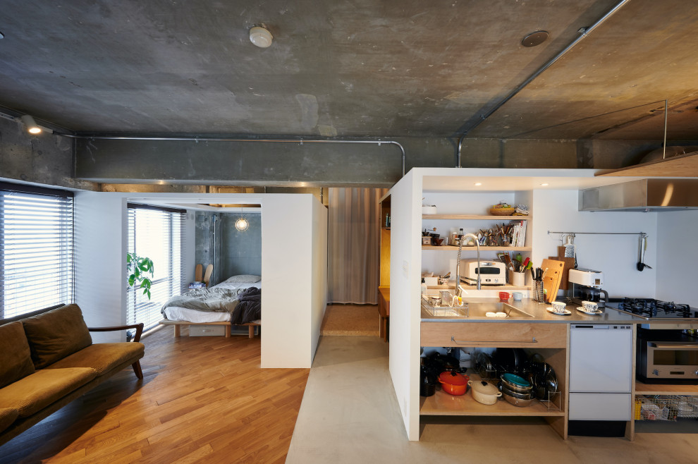 Photo of a medium sized industrial single-wall open plan kitchen in Tokyo with an integrated sink, open cabinets, beige cabinets, stainless steel worktops, white splashback, tonge and groove splashback, white appliances, concrete flooring, no island, grey floors, grey worktops and a timber clad ceiling.