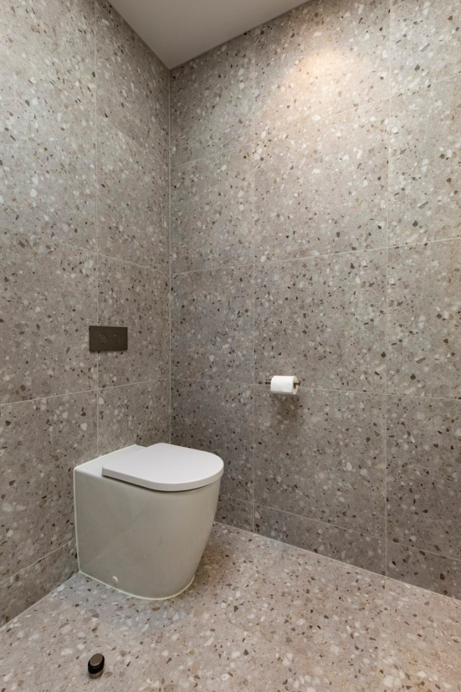 Mid-sized minimalist master white tile and stone tile porcelain tile, white floor and double-sink bathroom photo in Perth with flat-panel cabinets, black cabinets, a wall-mount toilet, gray walls, a vessel sink, granite countertops, black countertops and a floating vanity