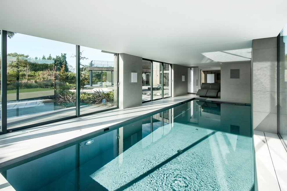 This is an example of a contemporary pool in Hampshire.