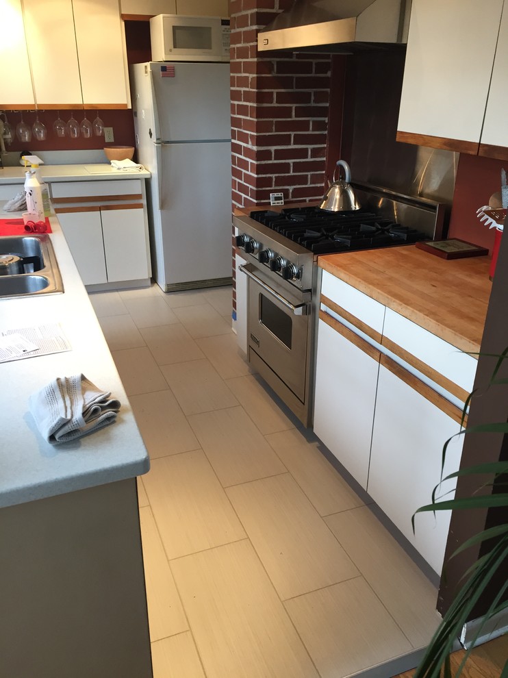 Kitchen - porcelain tile kitchen idea in Seattle