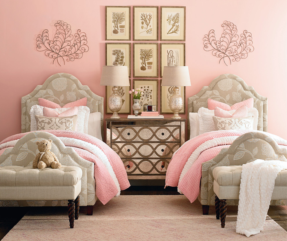 Design ideas for a mid-sized traditional kids' bedroom for kids 4-10 years old and girls in Oklahoma City with pink walls and dark hardwood floors.