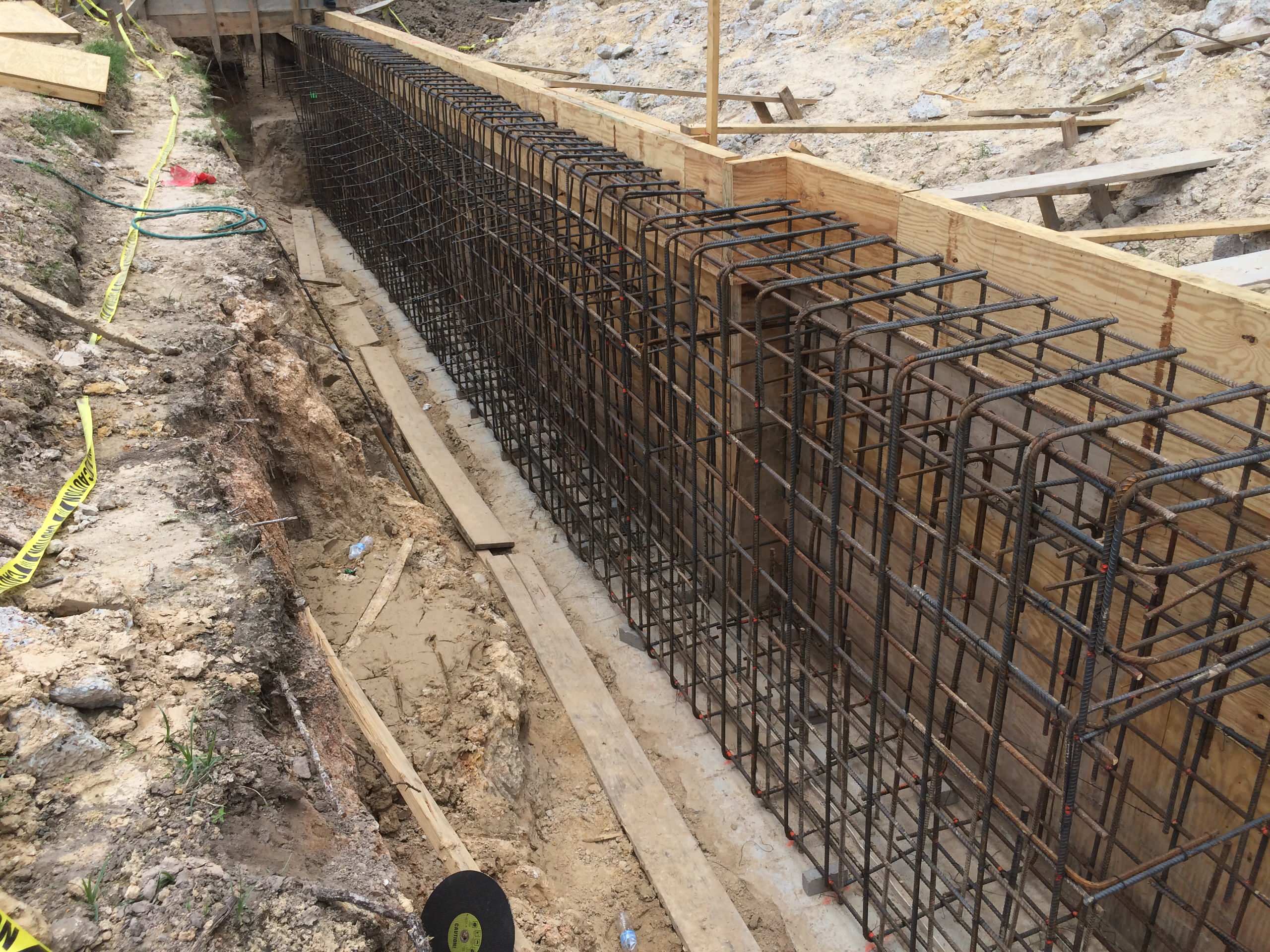 Steel cage for retaining wall of house.