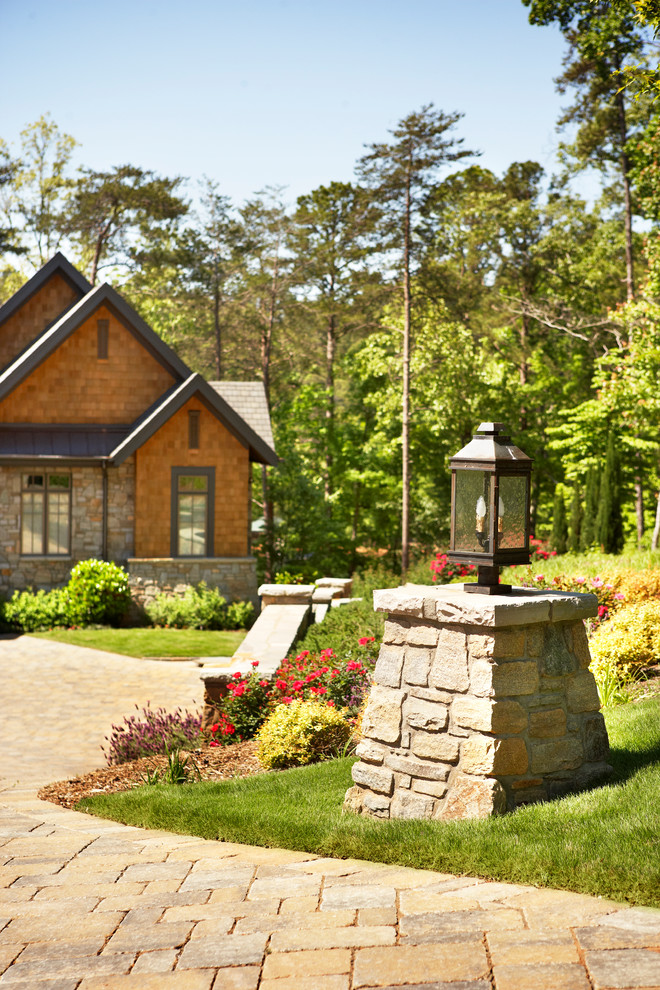 Inspiration for a rustic full sun front yard driveway for spring.