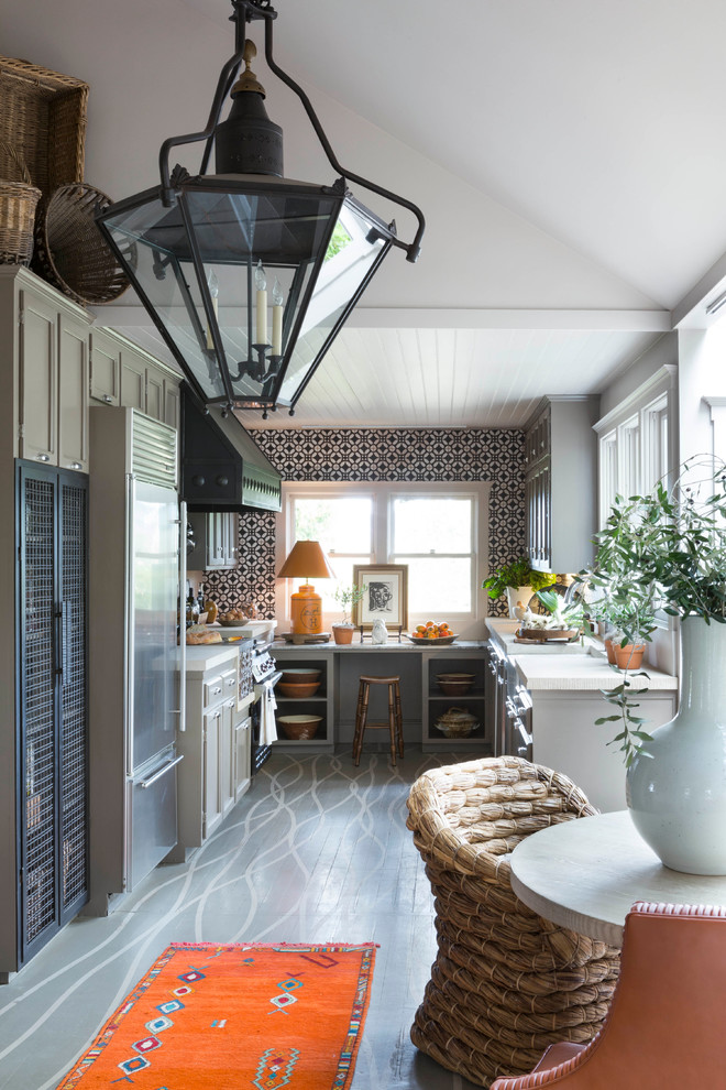 Country eat-in kitchen in San Francisco with a farmhouse sink, shaker cabinets, grey cabinets, multi-coloured splashback, stainless steel appliances, painted wood floors and no island.