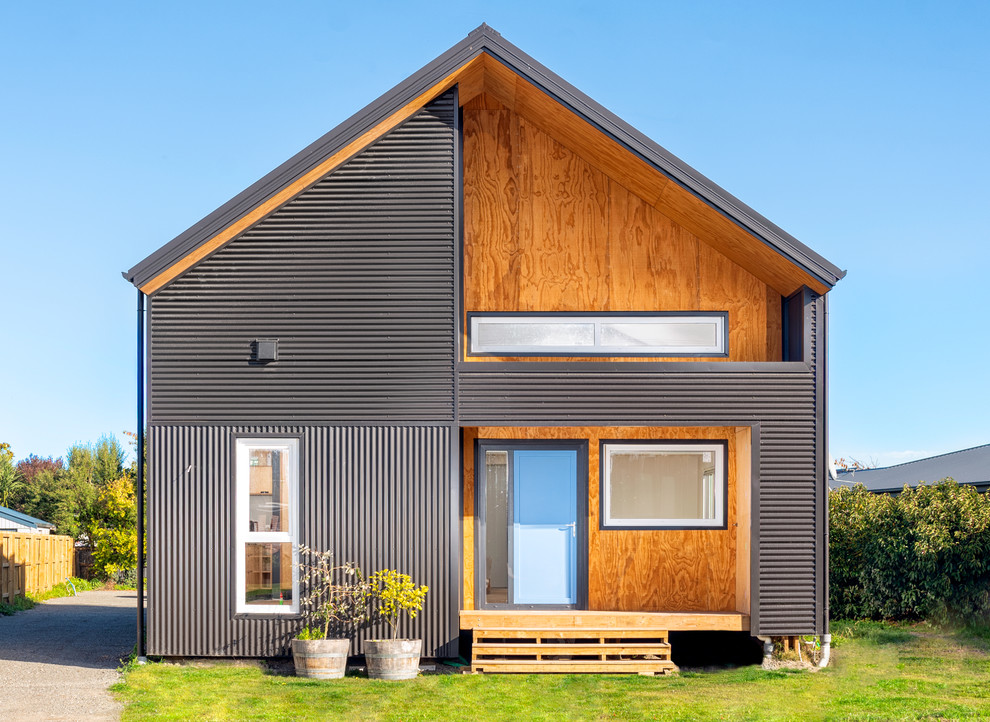 Inspiration for a Small contemporary Two-storey Grey house exterior in Christchurch With a Gable Roof.