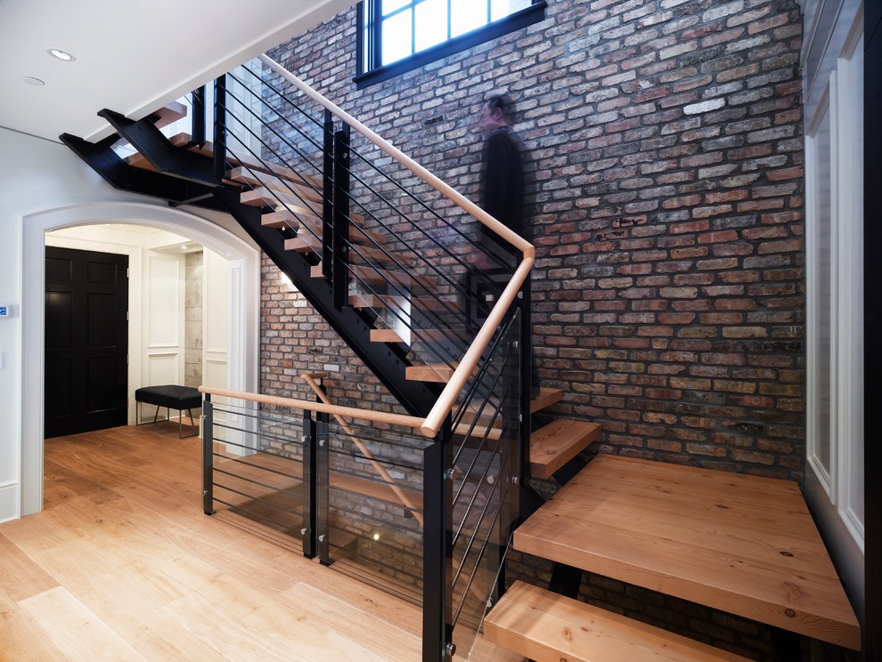 Photo of a mid-sized transitional wood l-shaped staircase in Vancouver.