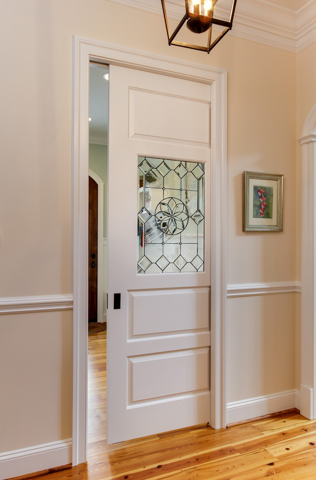 Design ideas for a traditional hallway in Raleigh with medium hardwood floors.