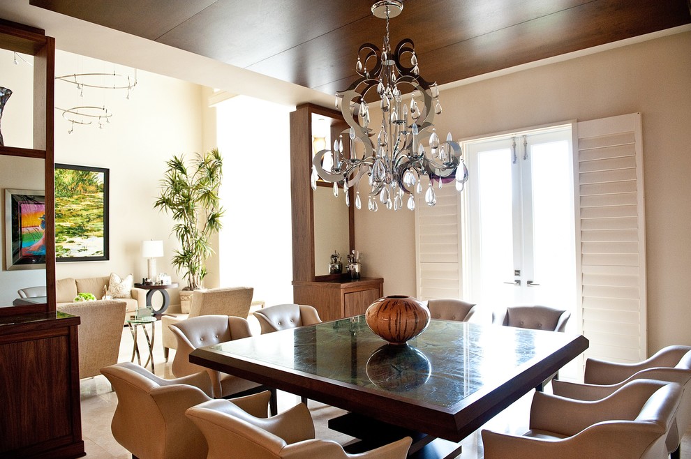 Inspiration for a mid-sized transitional separate dining room in Miami with beige walls and no fireplace.