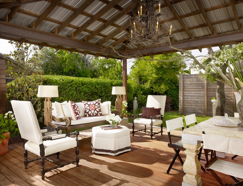 Inspiration for a traditional deck in Austin with a roof extension.