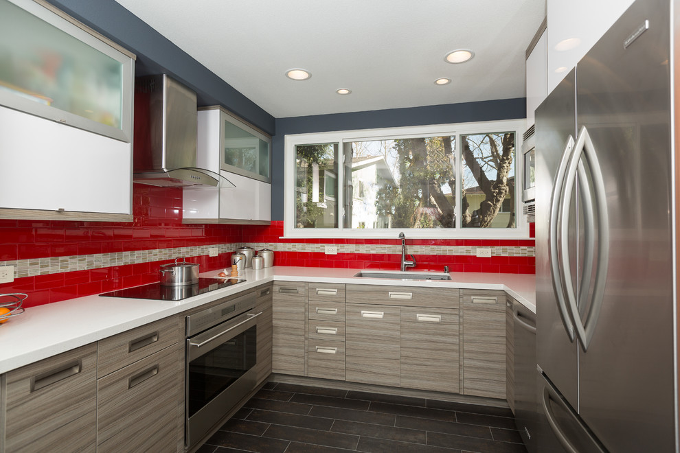 Design ideas for a small modern galley eat-in kitchen in Orange County with an undermount sink, flat-panel cabinets, grey cabinets, quartz benchtops, red splashback, glass tile splashback, stainless steel appliances and no island.