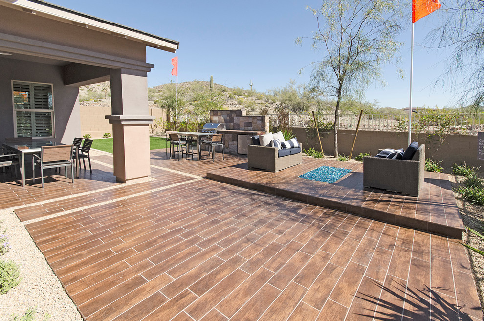 Photo of a large traditional backyard full sun garden for spring in Phoenix with decking.