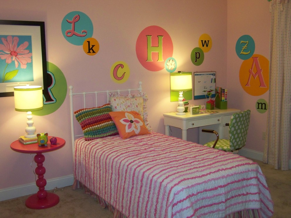 Design ideas for a contemporary kids' bedroom for kids 4-10 years old and girls in Atlanta with carpet and pink walls.