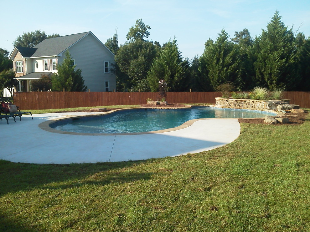 Pool fountain - large rustic backyard custom-shaped and concrete natural pool fountain idea in Atlanta