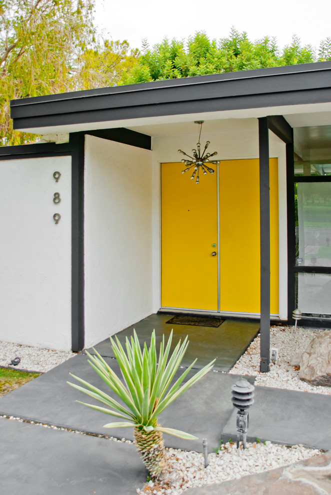 Midcentury front door in Los Angeles with a single front door and a yellow front door.