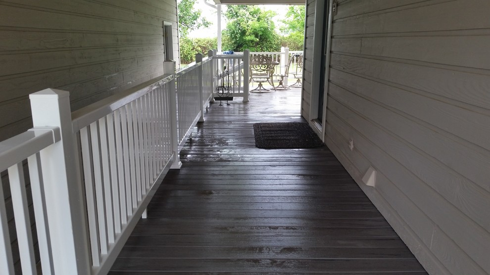 Large deck photo with a roof extension