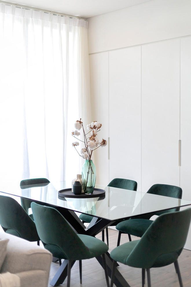 Inspiration for a contemporary open plan dining in Sydney with white walls, light hardwood floors and beige floor.