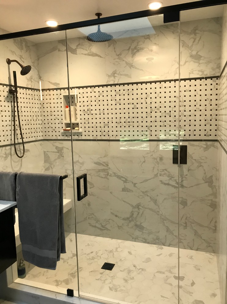 Photo of a mid-sized country master bathroom in San Francisco with flat-panel cabinets, black cabinets, a freestanding tub, a double shower, a one-piece toilet, white tile, porcelain tile, grey walls, porcelain floors, a vessel sink, engineered quartz benchtops, white floor and a hinged shower door.