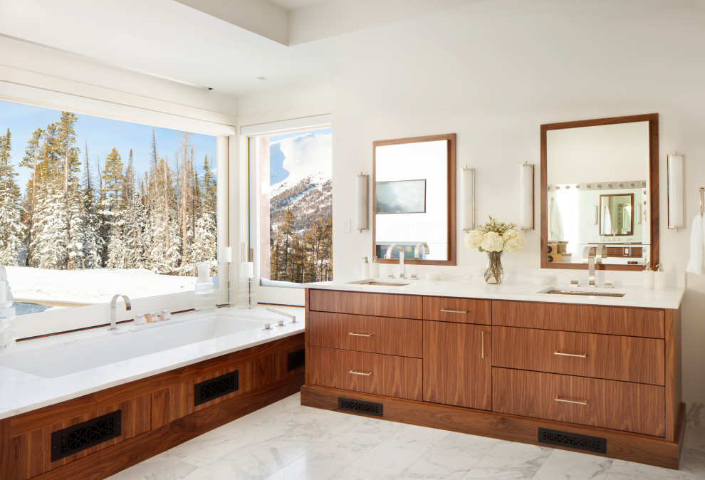 Photo of a country master bathroom in Other with flat-panel cabinets, medium wood cabinets, an undermount tub, white walls, an undermount sink, white floor, white benchtops, a double vanity and a built-in vanity.