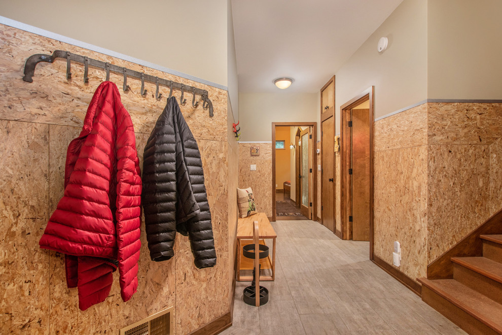 Mountain style entry hall photo in Grand Rapids with beige walls