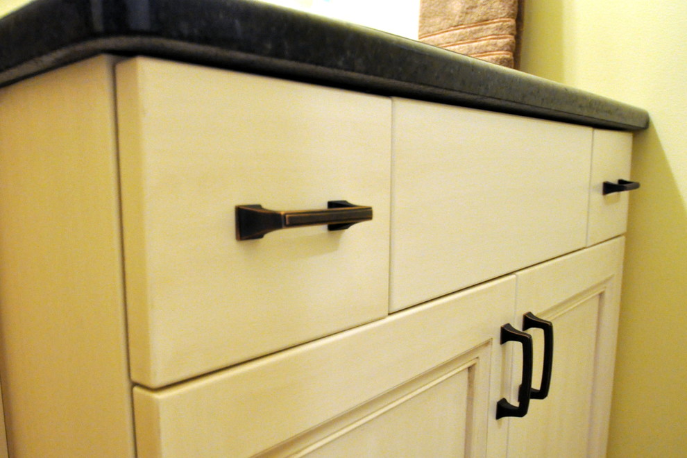 Example of a transitional porcelain tile alcove bathtub design in Chicago with an undermount sink and flat-panel cabinets
