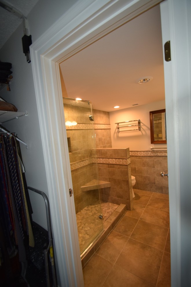 Small transitional master multicolored tile and ceramic tile ceramic tile doorless shower photo with raised-panel cabinets, white cabinets, a two-piece toilet, gray walls, a vessel sink and quartz countertops