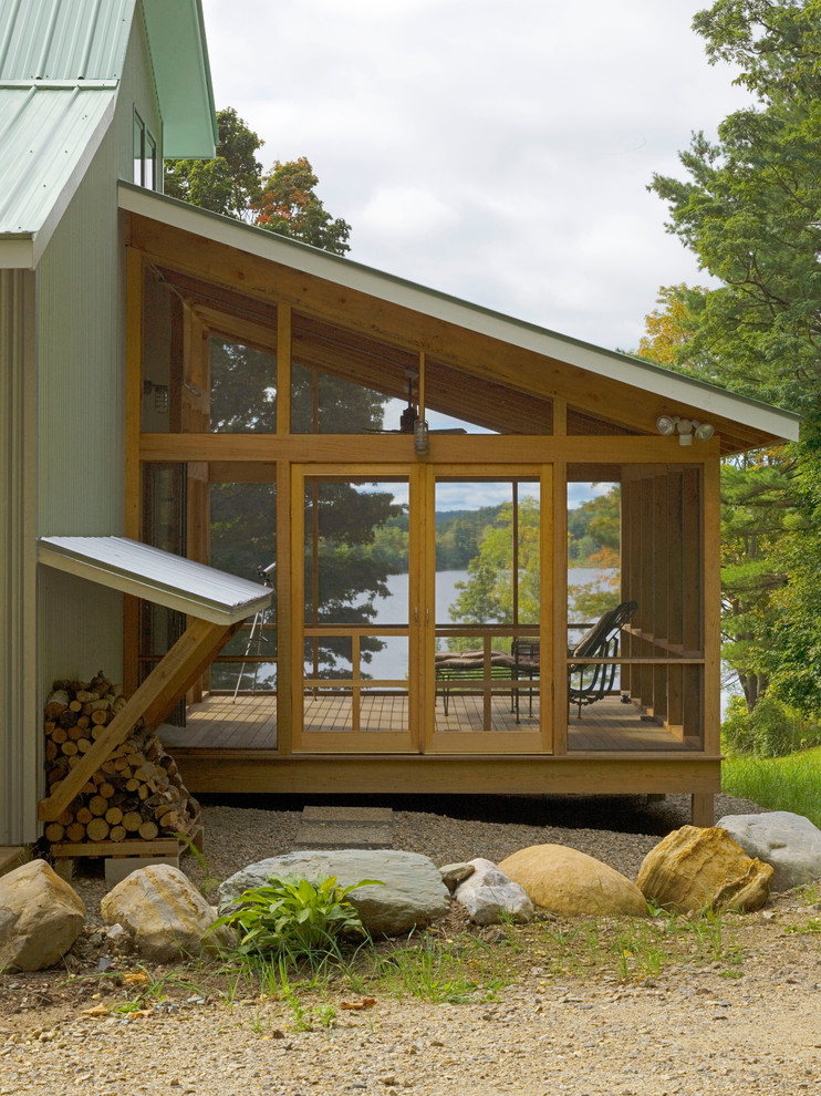 Design ideas for a country screened-in verandah in Burlington with decking and a roof extension.