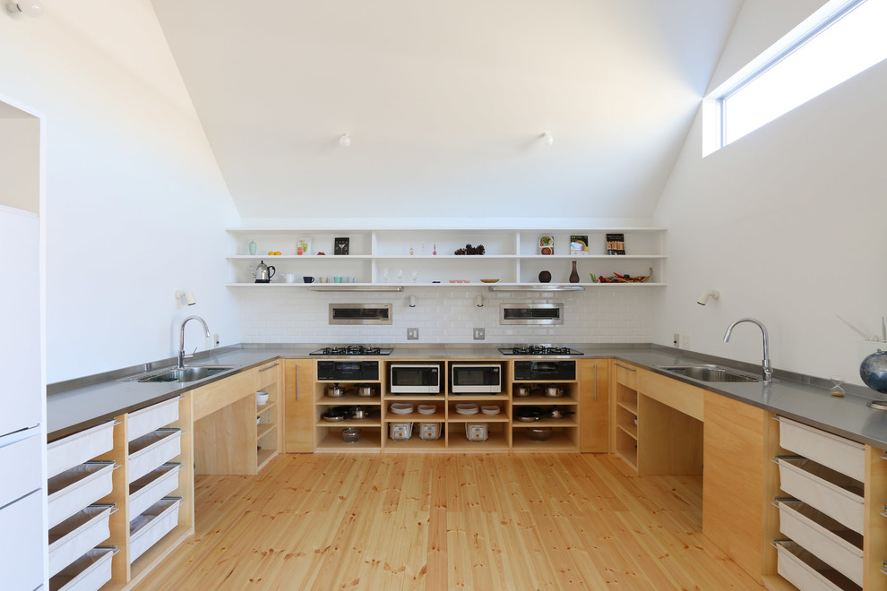 Inspiration for an asian kitchen in Tokyo with a single-bowl sink and medium hardwood floors.