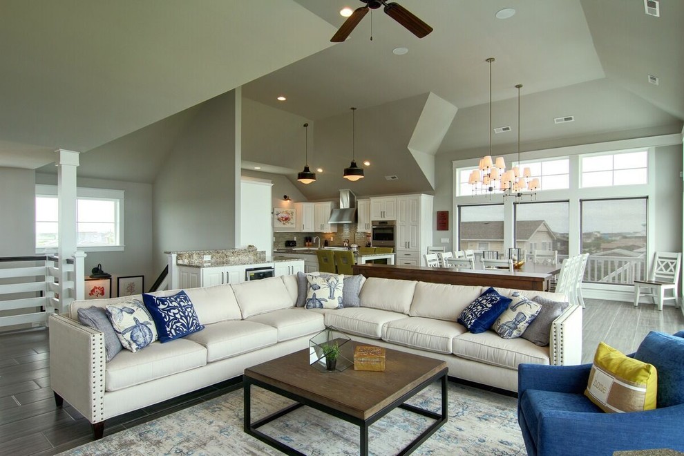 Photo of a mid-sized beach style formal open concept living room in Other with grey walls, dark hardwood floors, no fireplace and no tv.