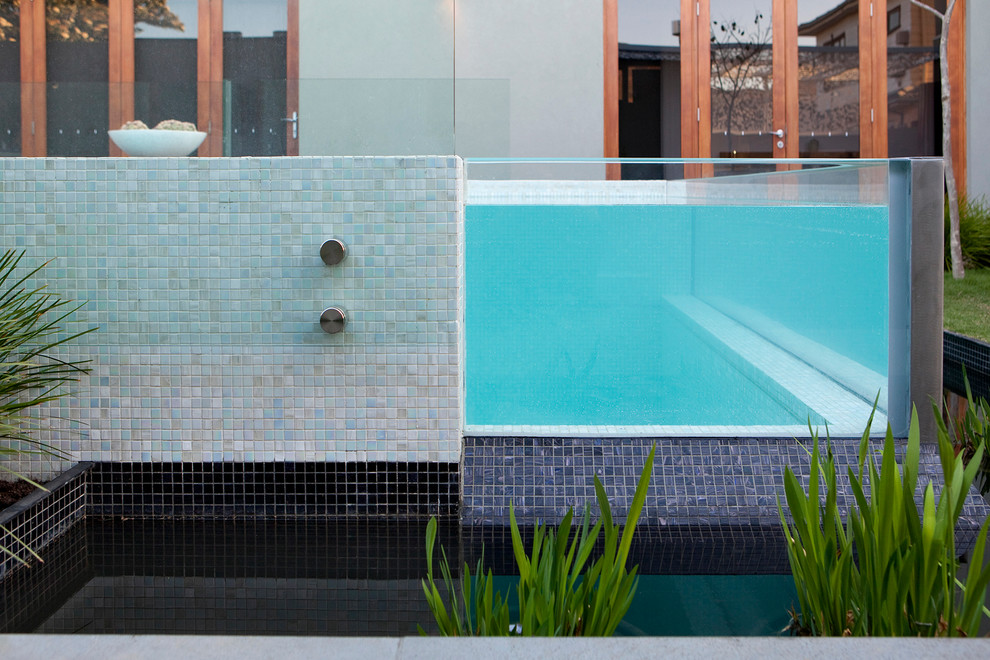 Inspiration for a contemporary backyard rectangular aboveground pool in Melbourne.