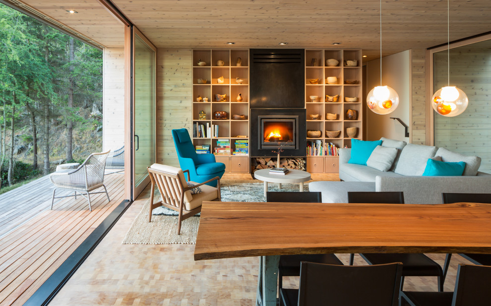 Mid-sized contemporary formal open concept living room in Seattle with medium hardwood floors, a standard fireplace and a stone fireplace surround.