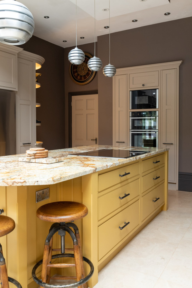 Design ideas for an expansive victorian galley kitchen/diner in London with a double-bowl sink, beaded cabinets, brown cabinets, granite worktops, yellow splashback, granite splashback, stainless steel appliances, ceramic flooring, an island, white floors, yellow worktops and a feature wall.