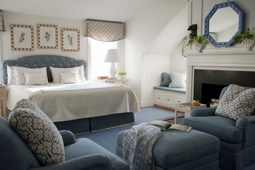 Photo of a mid-sized traditional master bedroom in Boston with white walls, a standard fireplace, a metal fireplace surround, carpet and blue floor.