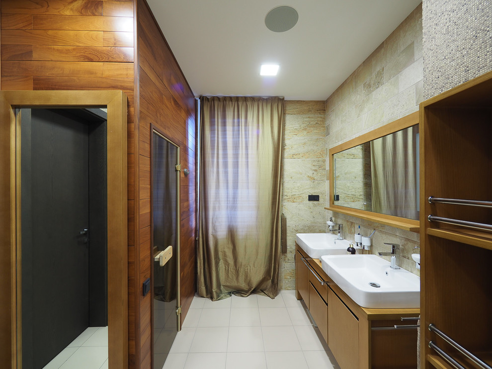 Photo of a mid-sized contemporary bathroom in Moscow with beige tile and with a sauna.