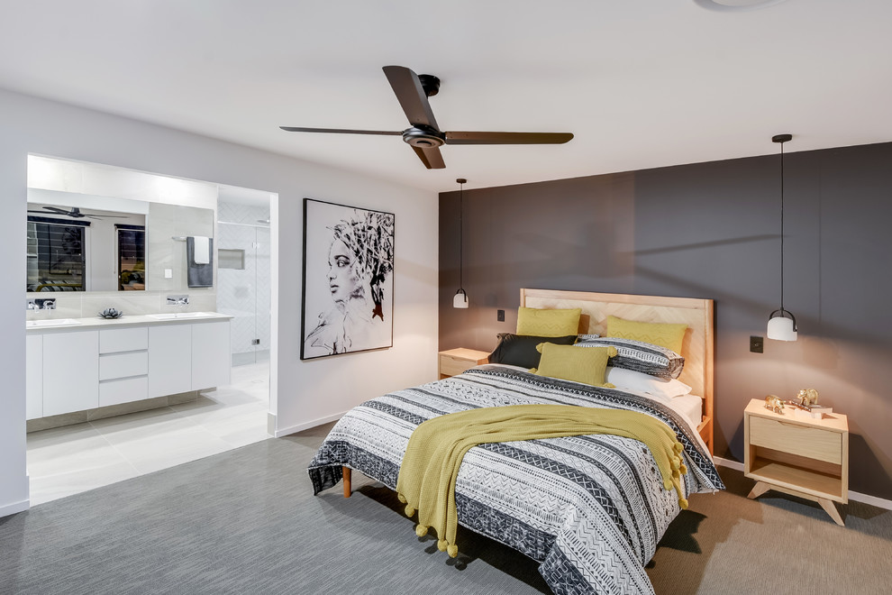 Large scandinavian master bedroom in Sunshine Coast with white walls, carpet and grey floor.