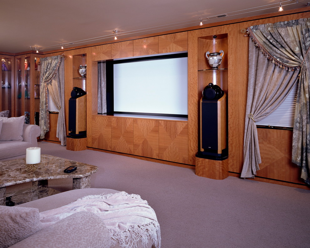 Photo of a large open concept home theatre in Philadelphia with brown walls, carpet and a projector screen.