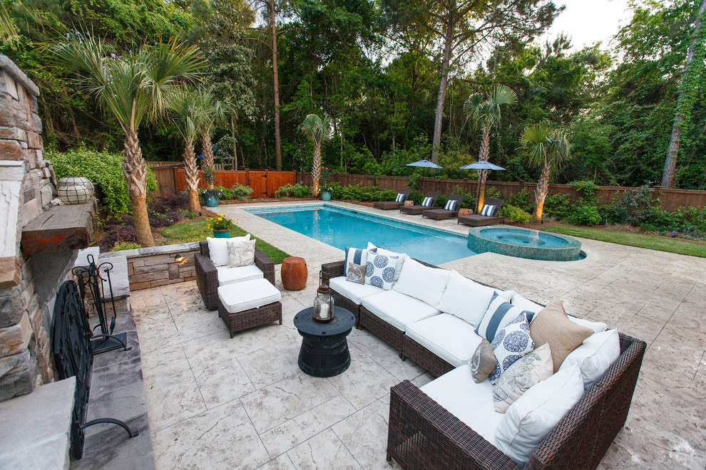 Large contemporary backyard rectangular pool in Charleston with a hot tub and stamped concrete.