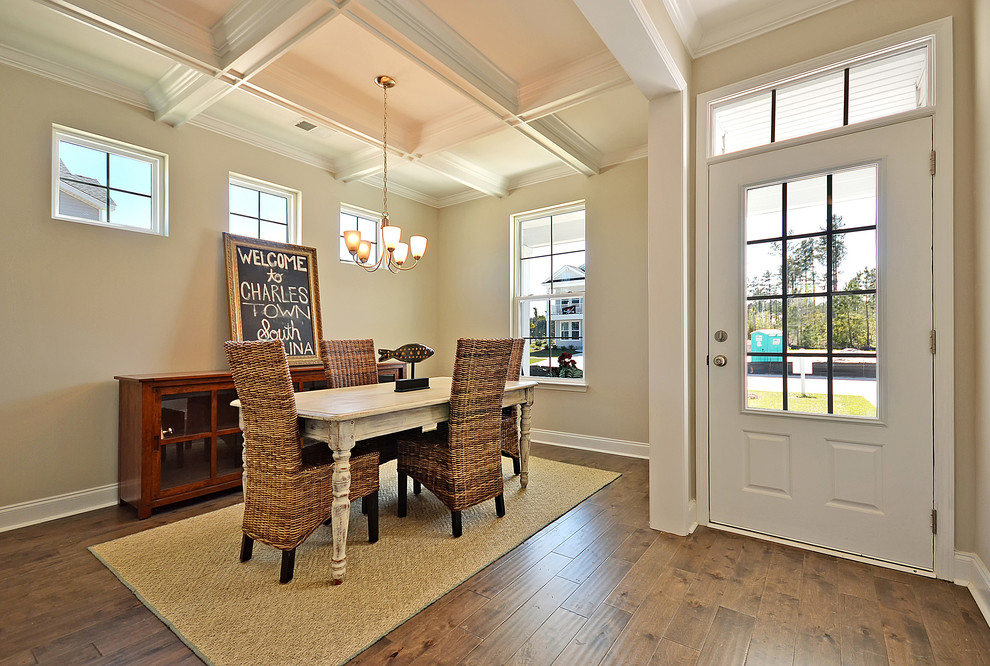 Traditional open plan dining in Charleston with beige walls, dark hardwood floors and no fireplace.
