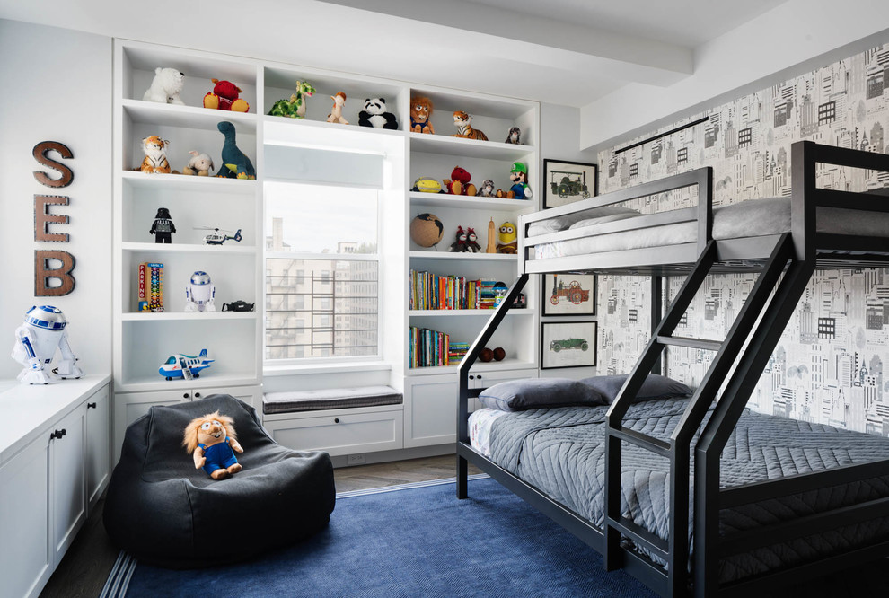 Design ideas for a contemporary kids' bedroom for kids 4-10 years old and boys in New York with white walls, dark hardwood floors and brown floor.