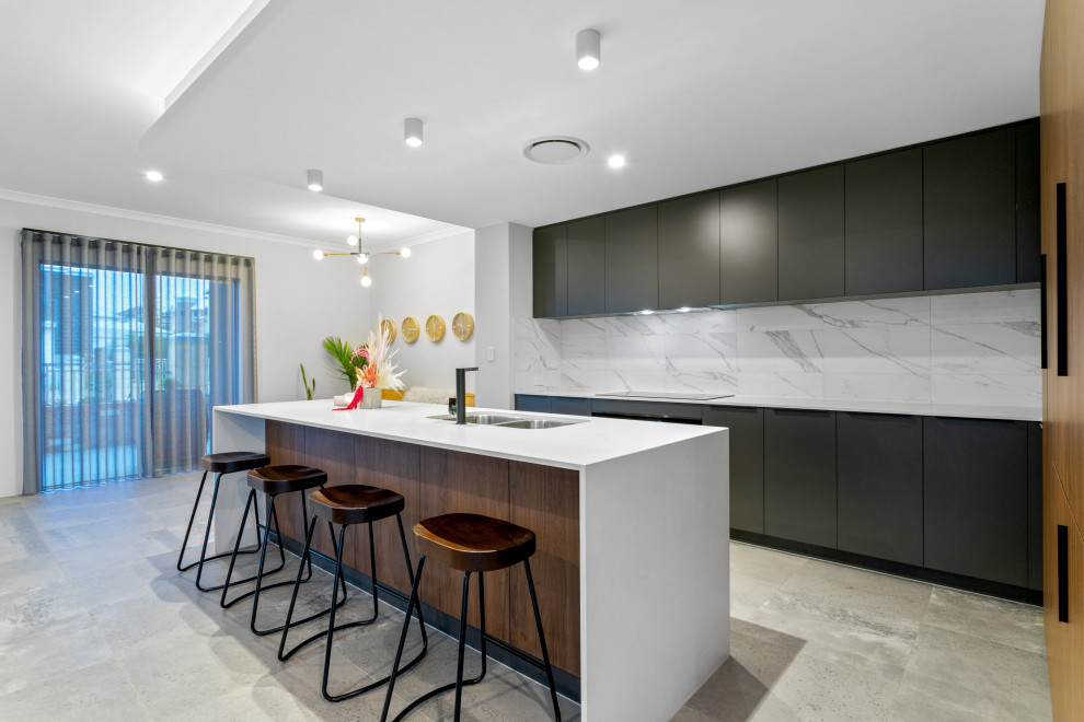 Large contemporary galley kitchen pantry in Perth with an undermount sink, black cabinets, quartz benchtops, white splashback, marble splashback, porcelain floors, with island, grey floor and white benchtop.