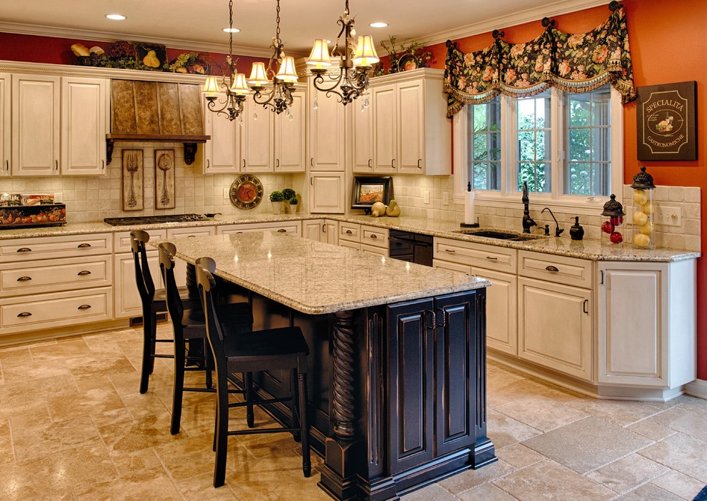 Photo of a mid-sized l-shaped eat-in kitchen in Indianapolis with an undermount sink, raised-panel cabinets, beige cabinets, beige splashback, granite benchtops, ceramic splashback, black appliances, ceramic floors, with island and beige floor.