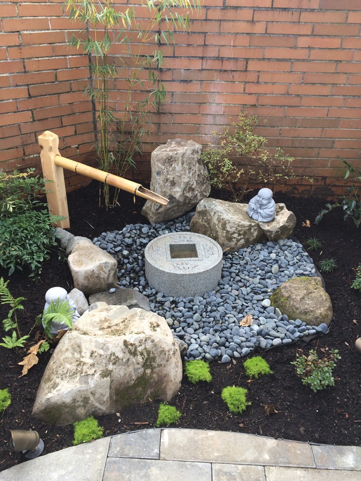 Design ideas for a small asian courtyard garden in Portland with a water feature.
