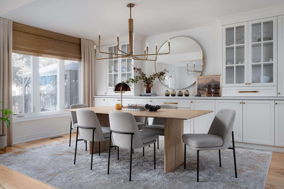 Inspiration for a mid-sized transitional medium tone wood floor and beige floor kitchen/dining room combo remodel in Toronto with white walls