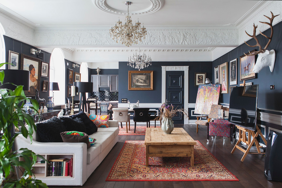 Eclectic formal open concept living room in Moscow with black walls, medium hardwood floors and a standard fireplace.