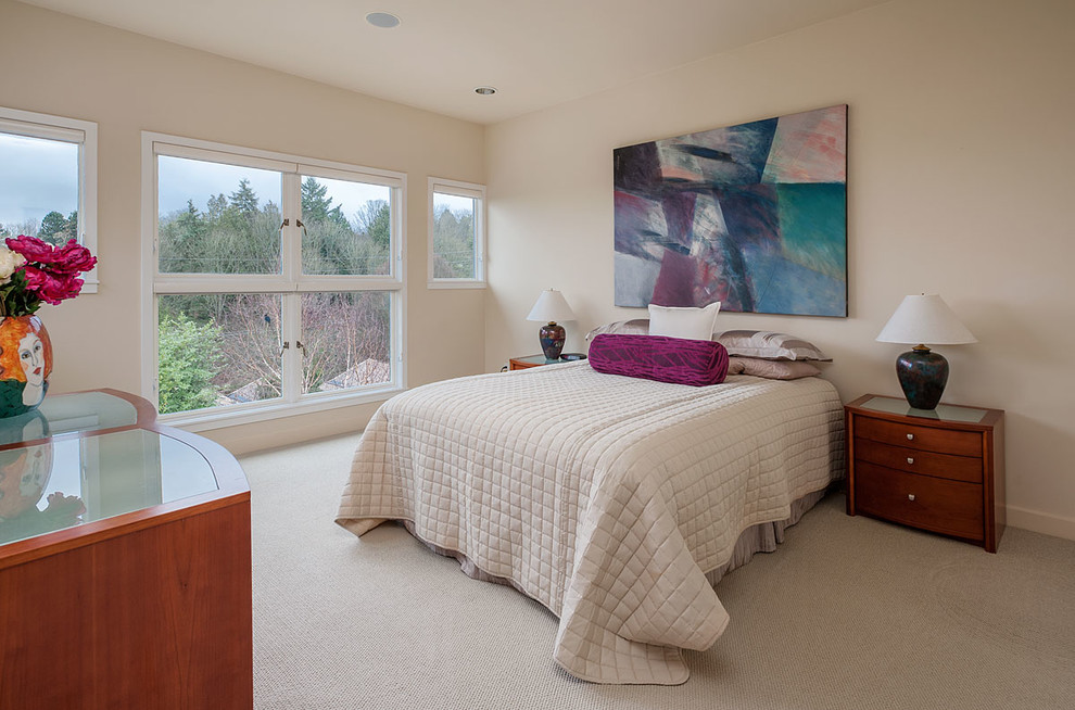 Design ideas for a contemporary bedroom in Seattle with beige walls and carpet.