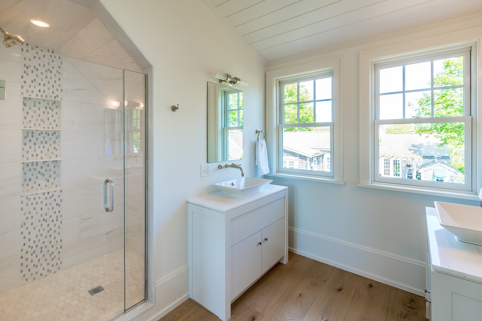 Inspiration for a transitional master bathroom in Other with flat-panel cabinets, white cabinets, white walls, light hardwood floors, a vessel sink and beige floor.