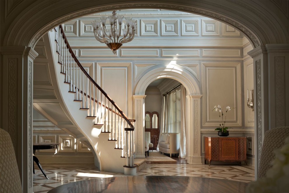 Inspiration for an expansive traditional foyer in Other with white walls and porcelain floors.