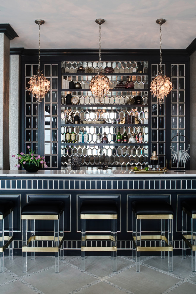 Inspiration for an expansive transitional galley seated home bar in Chicago with an undermount sink, raised-panel cabinets, black cabinets, quartz benchtops, mirror splashback, porcelain floors, white floor and white benchtop.