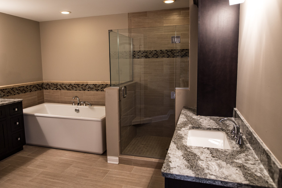 Mid-sized transitional master porcelain tile home design photo in Chicago with black cabinets, brown walls, an undermount sink and granite countertops