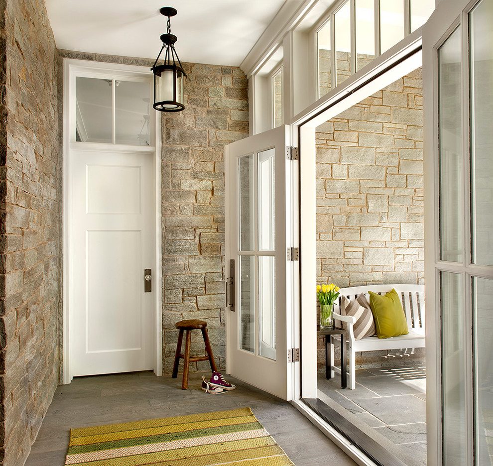 Country vestibule in Chicago with a double front door and a glass front door.
